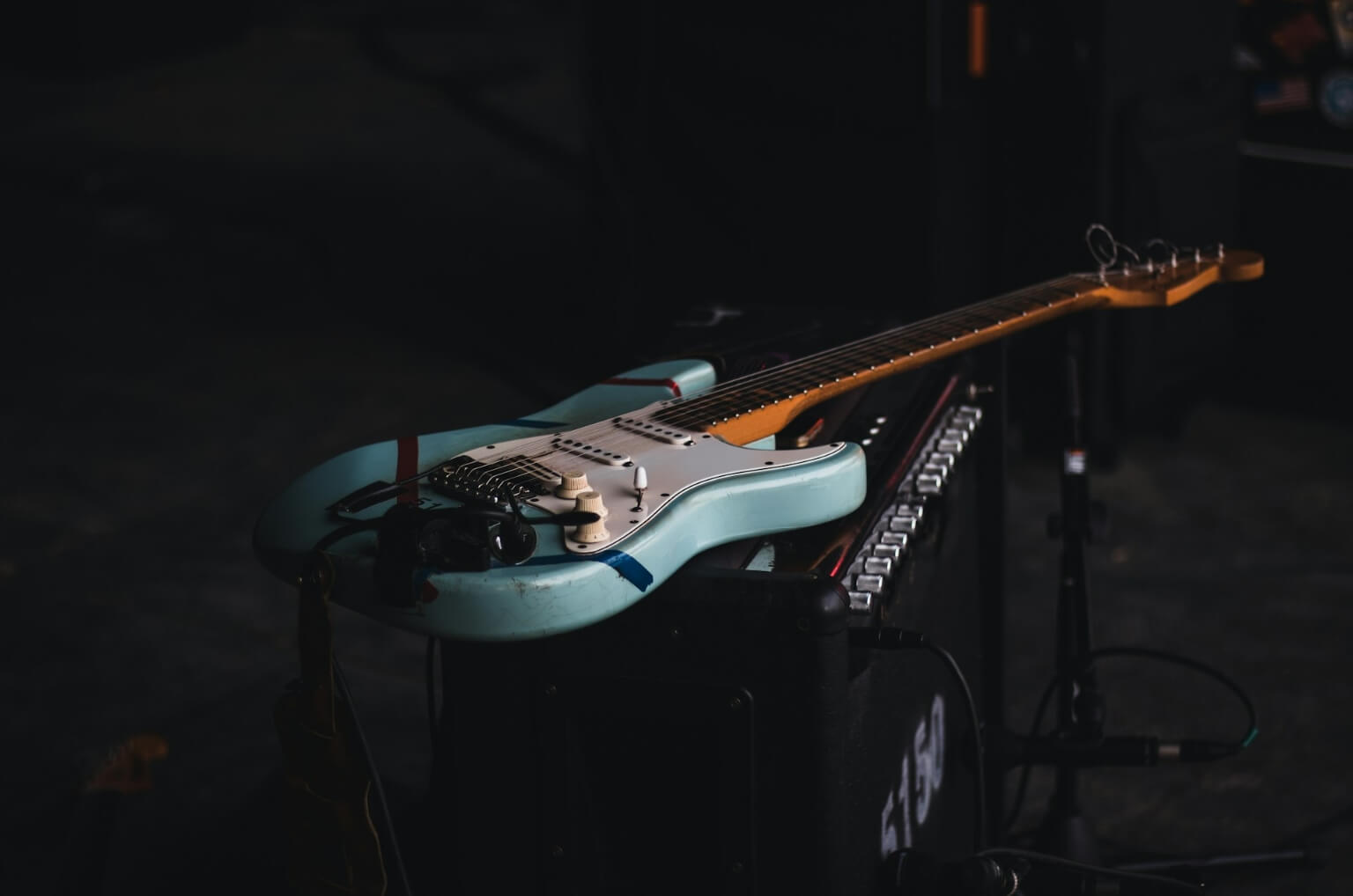 Guitar resting on amp